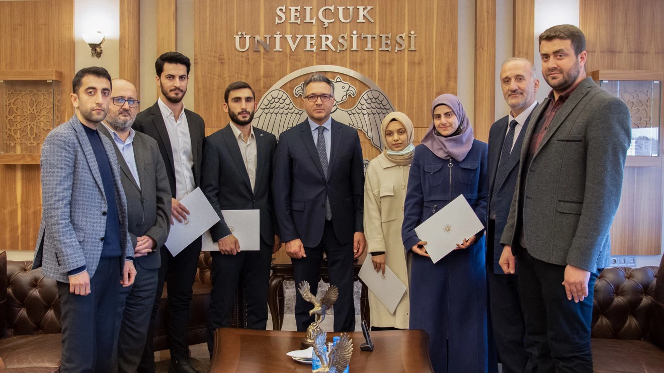 Rector Aksoy presents certificate of appreciation to Turkey's top students